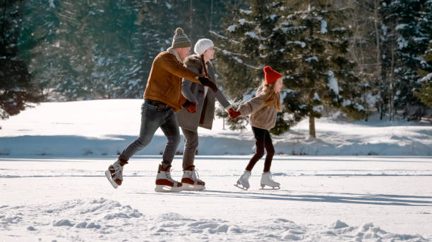 istock Family enjoying ice skating 1631511990