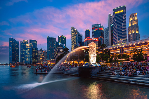 January 1, 2016: Merlion Statue, the official mascot of Singapore, at Marina Bay in Singapore. It is a mythical creature with a lion head and the body of a fish widely used to represent the city.
