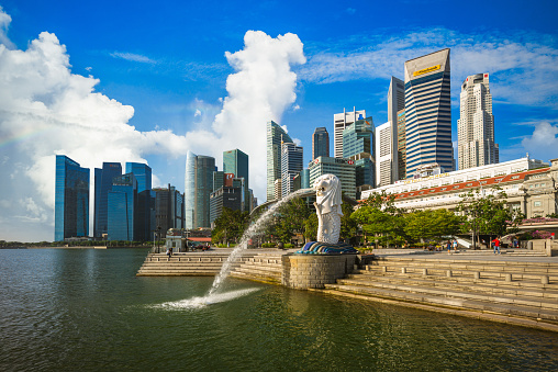 Singapore, Singapore - September 1, 2014: The Merlion fountain in front of the Marina Bay Sands hotel on September 01, 2014 in Singapore. Merlion is a imaginary creature with the head of a lion, seen as a symbol of Singapore