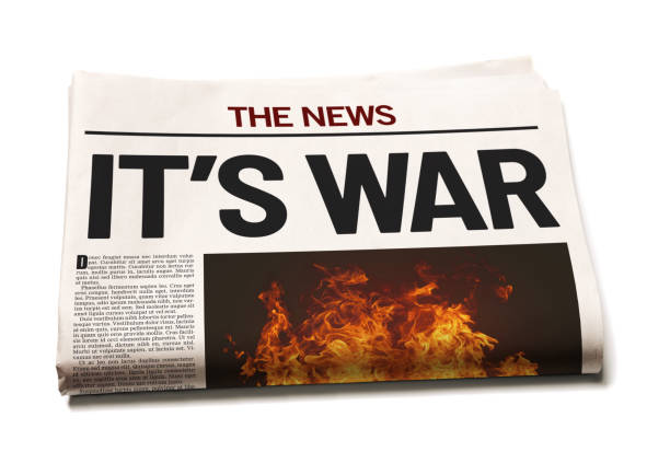 Newspaper announces outbreak of war with big headline on the front page IT'S WAR, says bold headline in a simulated newspaper. newspaper titles stock pictures, royalty-free photos & images