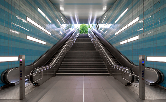 Low angle view of stairs and escalator at subway station Hamburg,  Germany Hamburg Überseequartier