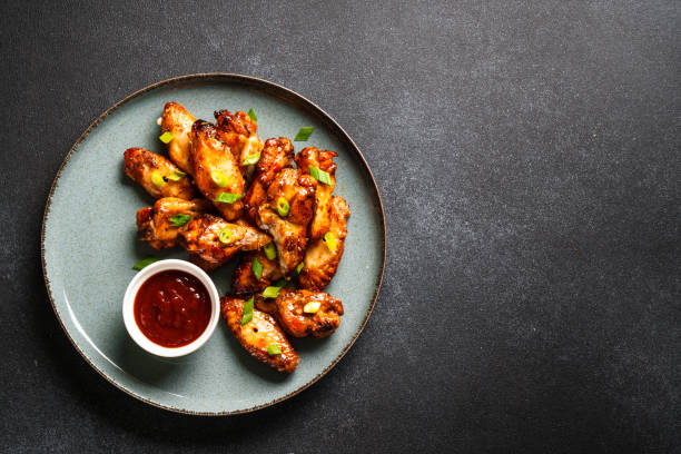 istock Chicken wings in bbq sauce grilled . 1631553720