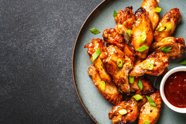 istock Chicken wings in bbq sauce grilled . 1631553724
