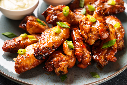 Chicken wings in bbq sauce. Close up.