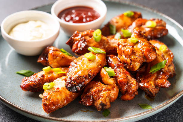istock Chicken wings in bbq sauce grilled . 1631554250