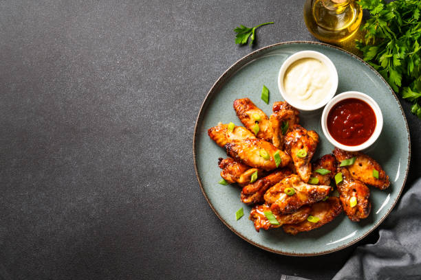 istock Chicken wings in bbq sauce grilled . 1631554255