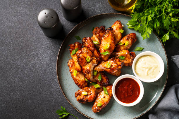 istock Chicken wings in bbq sauce grilled . 1631554772