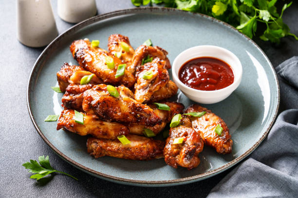 istock Chicken wings in bbq sauce grilled . 1631554780