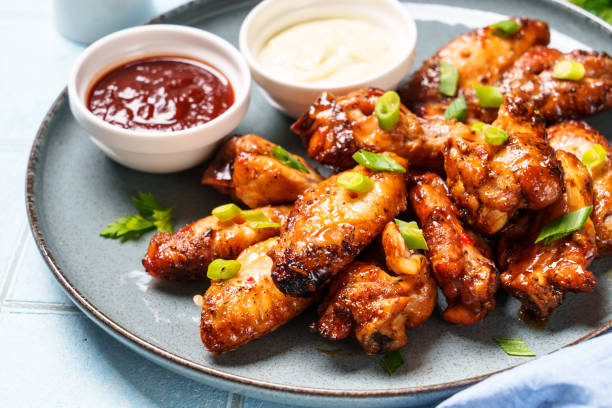 istock Chicken wings in bbq sauce grilled . 1631554784