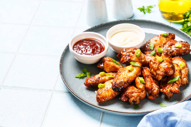 Chicken wings in bbq sauce grilled .