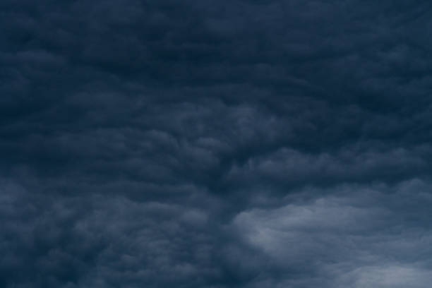 Rain clouds background. The clouds turn dark gray, like big smoke before rain
