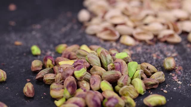 green nuts pistachios without shells, close up