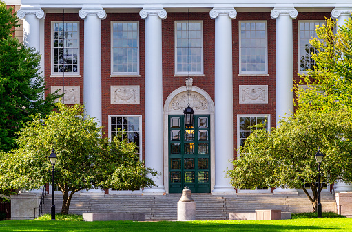 Boston, Massachusetts, USA - August 19, 2023: Entrance to the Baker Library on the Harvard Business School (HBS) campus. Dedicated in 1927 and named for George F. Baker, the benefactor who funded HBS's original campus. It is the largest business library in the world.