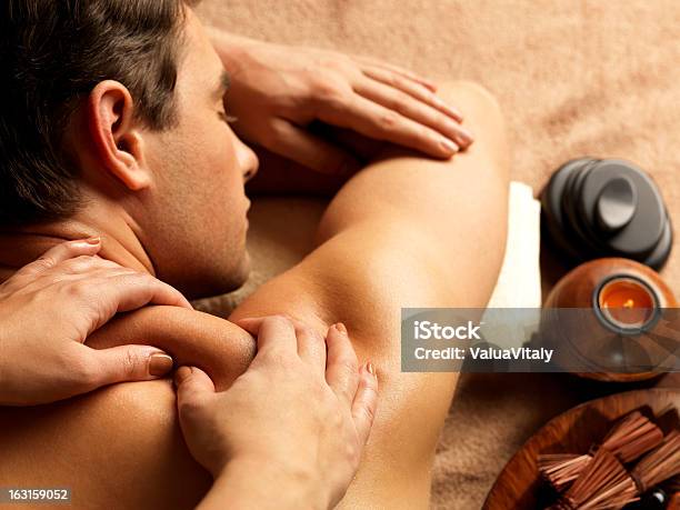 Man Having Massage In The Spa Salon Stock Photo - Download Image Now - Adult, Adults Only, Alternative Therapy