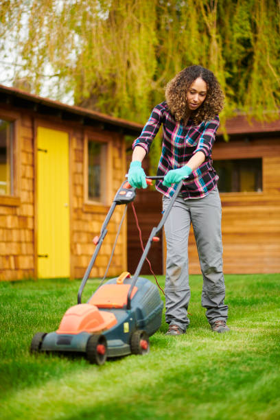 istock young woman mowing the lawn 1631591622