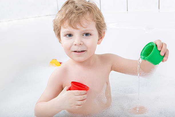 istock Adorable toddler boy having fun in bathtub 163159736