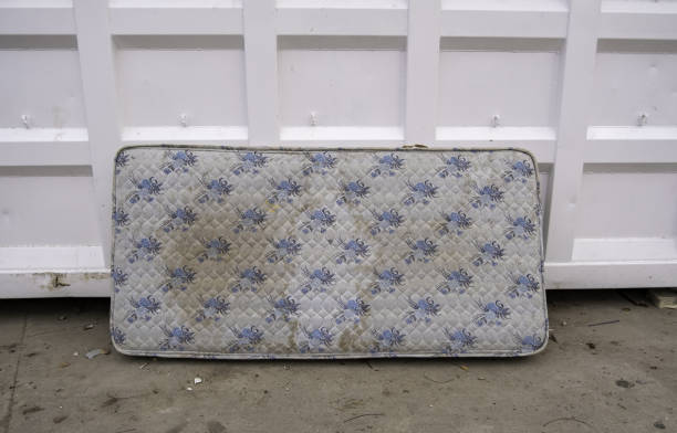 Old mattress in the trash