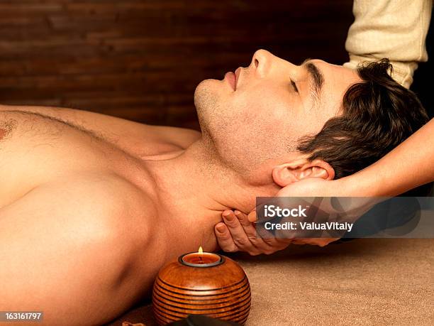 Man Having Neck Massage In The Spa Salon Stock Photo - Download Image Now - Men, Candle, Massage Therapist