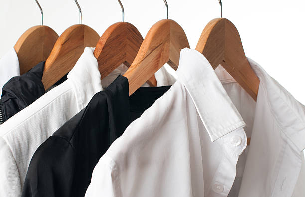 istock Black and white clothes on a rack, close-up 163161963
