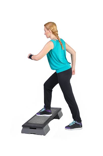 istock Fit young female aerobic instructor showing different exercises 163162389
