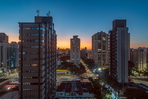 Sao Paulo City. Brazil. Sunset in Campo Belo and Brooklin district. Car traffic on Vereador José Diniz avenue.