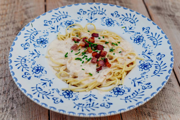 istock Italian pasta dish with white and tomato sauces 1631637971