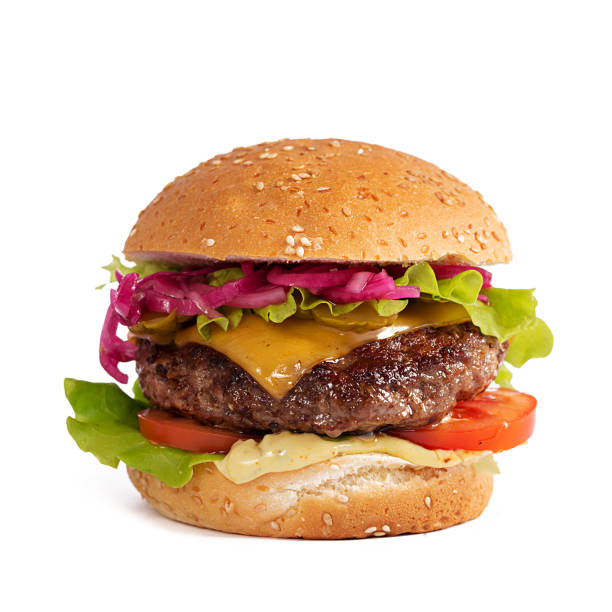 istock Beef hamburger. Cheeseburger with beef burger, tomatoes, cheese, pickled cucumber and lettuce isolated on white background 1631661376