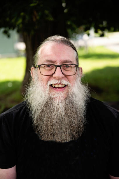 istock Portrait of a senior man with a long beard outdoors in summer. 1631661814