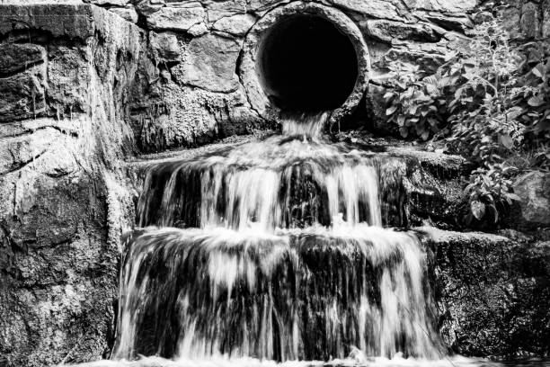 Photography on theme beautiful fall water from garden waterfall, natural texture close up, photo consisting of fall clear water with nature garden waterfall, speed fall water out garden long waterfall