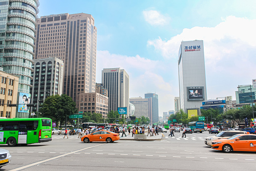 Seoul, South Korea - July 25, 2021: Cityscape of the Korean capital city. Street view of the asian metropolis. City view or street scenery  Seoul. Colourful street advertising on the facade.