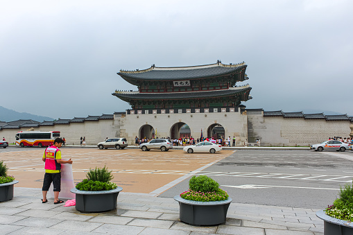 Seoul, South Korea - July 25, 2020: Gwanghwamun main entrance gate to the Gyeongbokgung Palace. Most important royal palace of Joseon Dynasty, cultural heritage. Pine wood used in the construction.