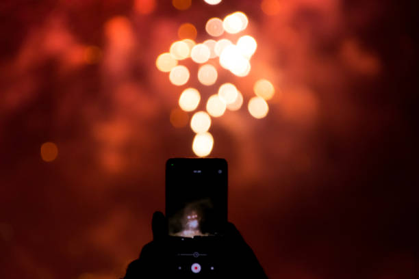 istock fireworks seen from a cell phone 1631683782
