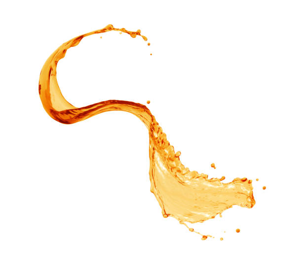 istock Splashes of fresh orange juice isolated on white background 1631688748