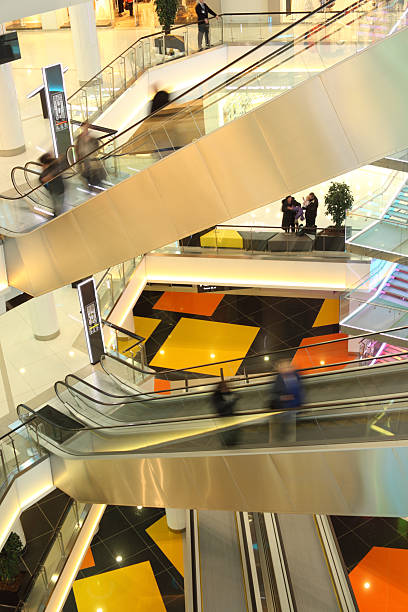 istock mall with escalators and people in motion 163171740