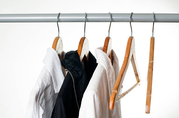istock Black and white clothes on a rack, close-up 163171743