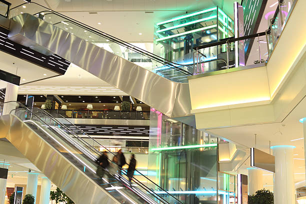 istock mall with escalators and people in motion 163171777