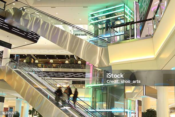 Mall With Escalators And People In Motion Stock Photo - Download Image Now - Activity, Architectural Column, Architecture