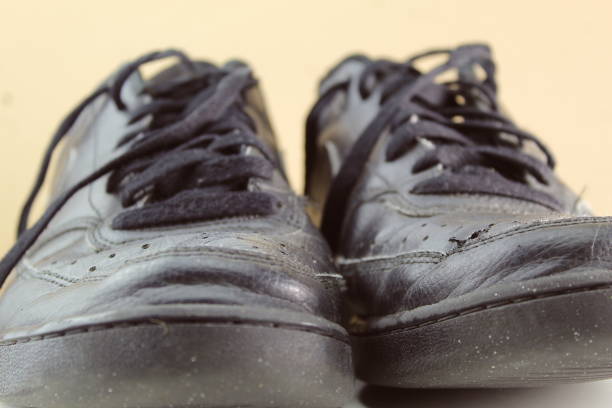 istock Black worn untied school shoes 1631743328