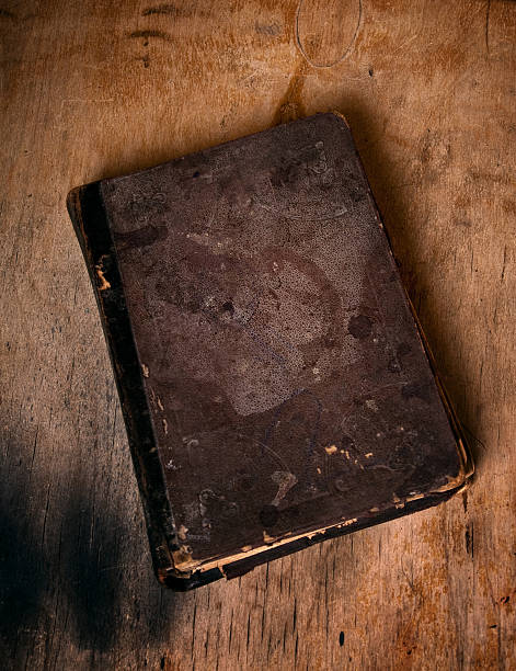istock Old book on dirty wooden floor 163174938
