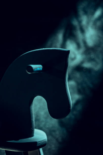 Old wooden rocking horse in spooky house