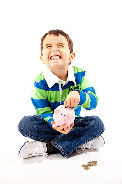 istock Playful Boy With Piggy Bank 163176583