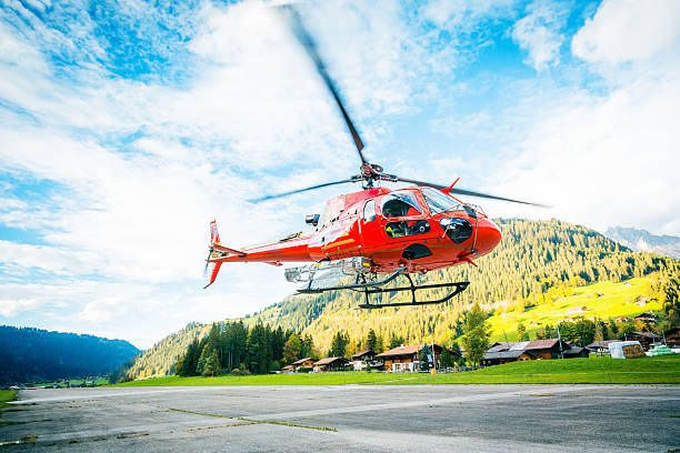 istock red helicopter in the swiss alps 163176786