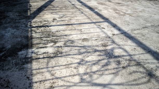 istock the morning sun illuminates a house terrace railing so that it forms a shadow on the cement floor 1631771868