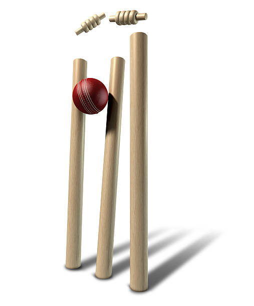 Cricket Ball Hitting Wickets Perspective Isolated A red leather cricket ball striking and unsettling wooden cricket wickets and bails on an isolated background wicket stock pictures, royalty-free photos & images