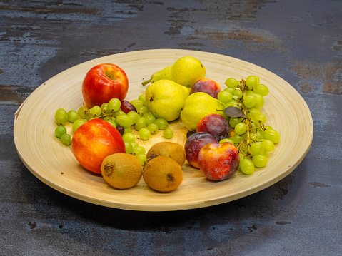 fruits plate with grapes, pears, apples, banana
