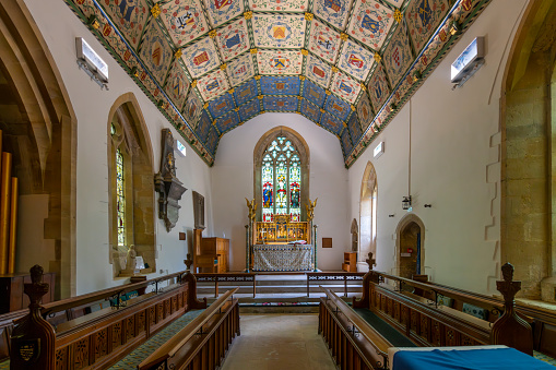 The beautifully simple Victorian interior of All Saints Church in Ramsholt, Suffolk, Eastern England. The church dates from Norman times but was derelict by the mid-19th century. The old box pews face the pulpit rather than the altar - the Word being more important at the time than the Sacrament.