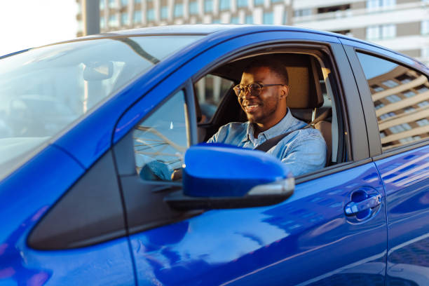 istock Cheerful male driver in the car 1631861058