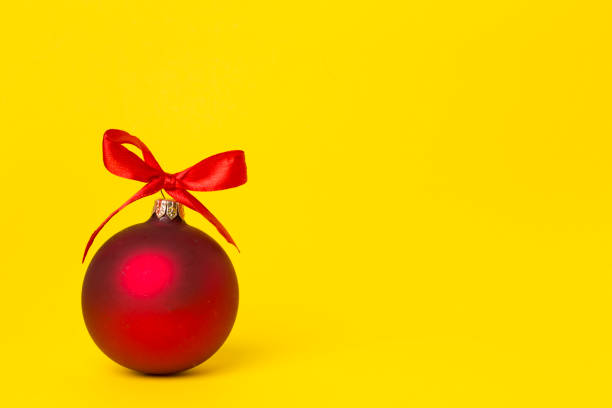 Christmas ball toy on color background.