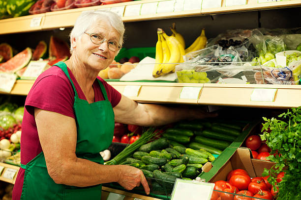 istock Senior woman arranging vegetables on shelf 163186601