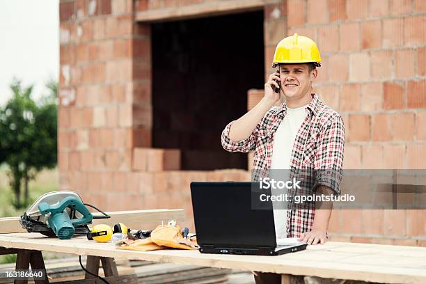 Carpenter Talking On Mobile Phone Stock Photo - Download Image Now - Carpenter, Happiness, Using Phone